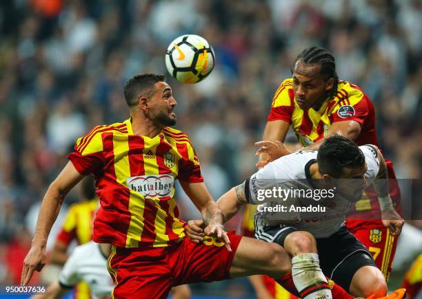 Alvaro Negredo of Besiktas in action against Gilberto Olivera Souza and Issiar Dia of Evkur Yeni Malatyaspor during Turkish Super Lig soccer match...