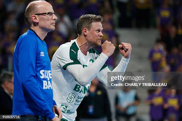 Skjern's Kasper Sondergaard Sarup gestures next to Skjern's coach Ole Norgaard during the EHF Champions League quarter-final handball match between...