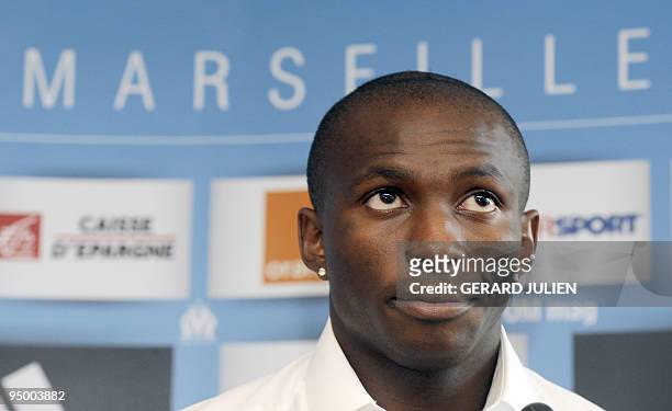 Cameroon international midfielder Stephane Mbia listens during a press conference which introduced his arrival at the Olympic of Marseille football...