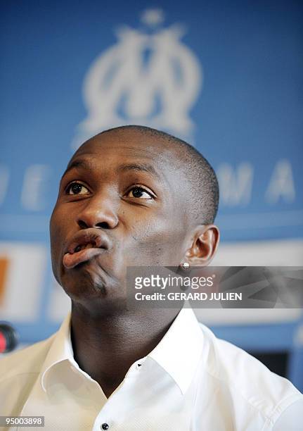 Cameroon international midfielder Stephane Mbia gestures during a press conference which introduced his arrival at the Olympic of Marseille football...