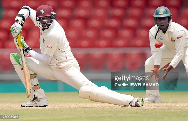 West Indies cricket team captain Floyd Reifer hits the ball off Bangladeshi bowler Shakib Al Hasan during the final day of the first Test match...