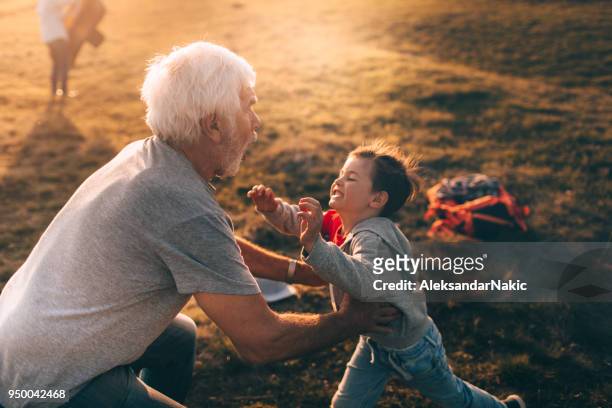 i love my grandfather! - embracing grandma stock pictures, royalty-free photos & images