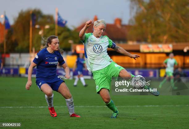 Nilla Fischer of Wolfsburg controls the ball watched by Erin Cuthbert of Chelsea during the UEFA Womens Champions League Semi-Final: First Leg...