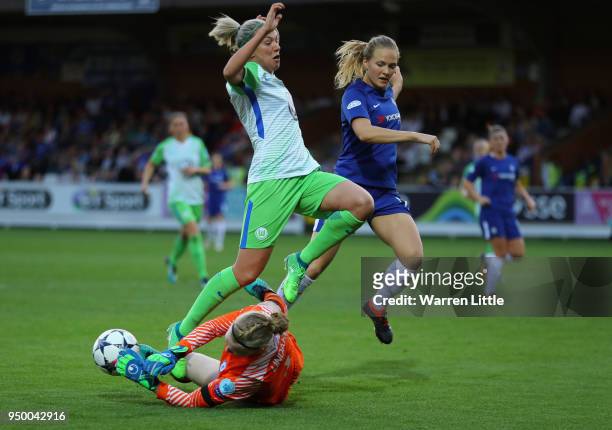 Zsanett Jakabfi of Wolfsburg is tackled by Hedvig Lindahl of Chelsea during the UEFA Womens Champions League semi-final first leg match between...