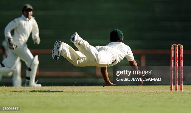 Bangladeshi cricketer Tamim Iqbal fields the ball during the final day of the first Test match between West Indies and Bangladesh at the Arnos Vale...