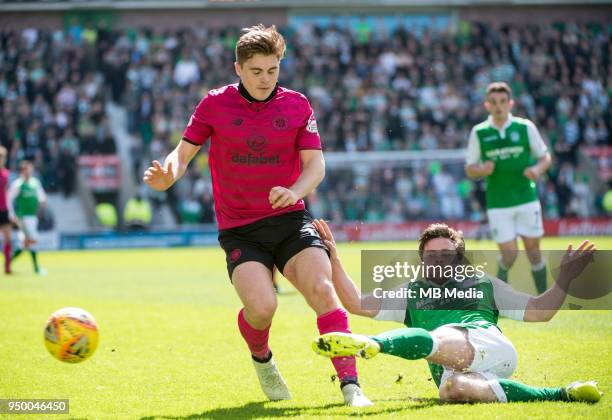 Hibs' midfielder, Lewis Stevenson puts in a timely tackle on Celtic midfielder, James Forrest, as Hibernian play host to Celtic in the Ladbrokes...