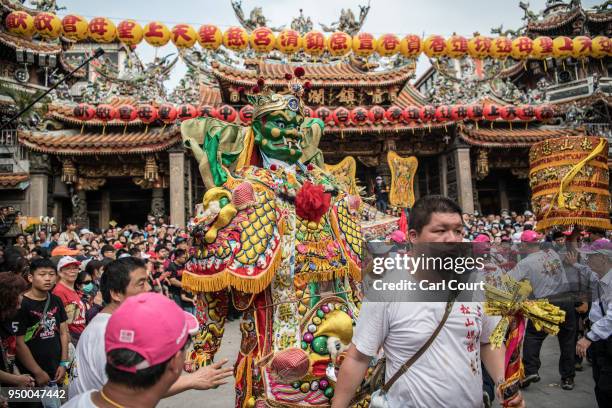 Man dressed as a Taiwanese deity performs at Jenn Lann Temple during festivities marking the end of the nine day Mazu pilgrimage, on April 22, 2018...