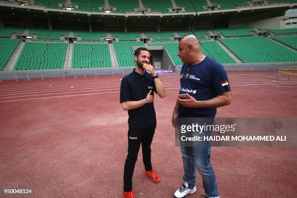 Lluc Sau, the FutbolNet coordinator in Catalonia, talks with Iraqi sport teacher during a workshop organised by FutbolNet, which is part of the Barca...