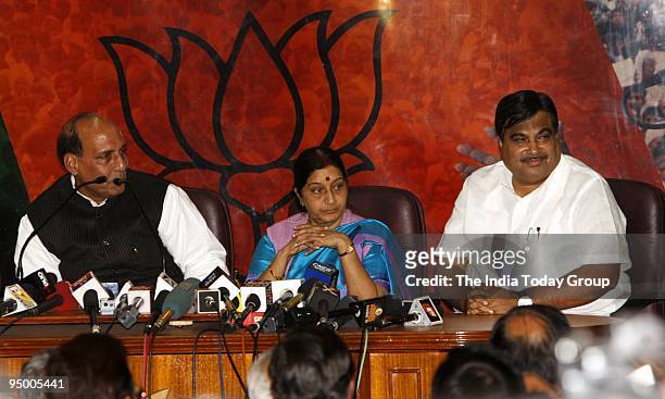 Former BJP president Rajnath Singh, Leader of Opposition in Lok Sabha Sushma Swaraj and new BJP president address a press conference in New Delhi on...