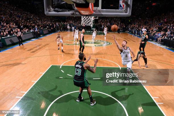 Milwaukee, WI Matthew Dellavedova of the Milwaukee Bucks shoots the ball against the Boston Celtics in Game Four of Round One of the 2018 NBA...