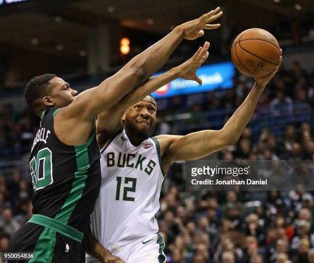Jabari Parker of the Milwaukee Bucks drives against Guerschon Yabusele of the Boston Celtics during Game Four of Round One of the 2018 NBA Playoffs...