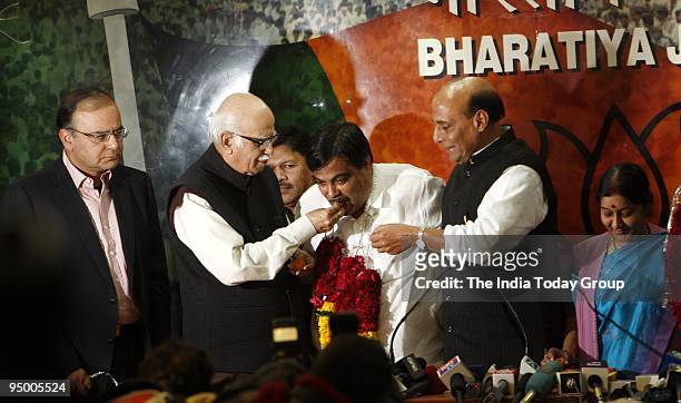 Lal Krishna Advani greets new BJP president Nitin Gadkari at the party office in New Delhi on Saturday, December 19, 2009.