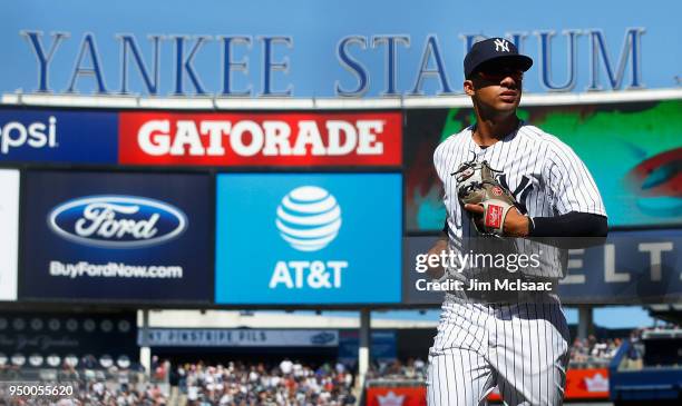 Gleyber Torres of the New York Yankees runs off the field to the dugout after the seventh inning against the Toronto Blue Jays at Yankee Stadium on...