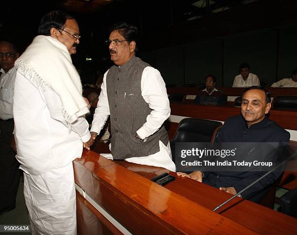 Venkaiah Naidu greets Gopinath Munde at the BJP Parliamentary Board meeting.