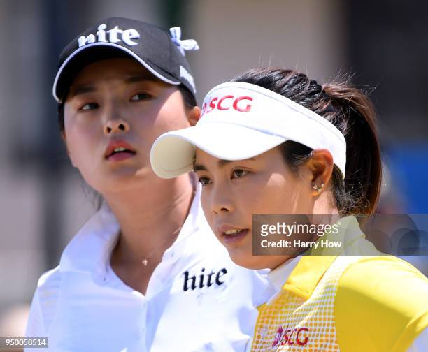 Moriya Jutanugarn of Thailand and Jin Young Ko of South Korea wait to tee off on the first hole during round four of the Hugel-JTBC Championship at...