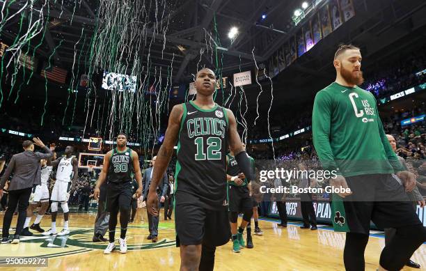 As Milwaukee's Jabari Parker and Thon Maker celebrate in the background at far left, the streamers celebrating the Bucks victory start to fall from...