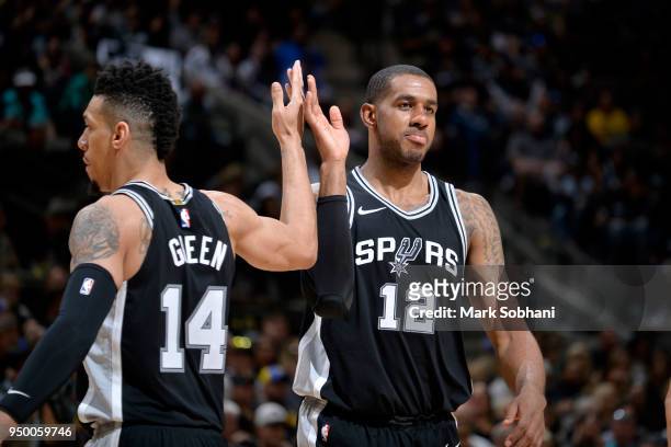 Danny Green and LaMarcus Aldridge of the San Antonio Spurs react to a play in Game Four of the Western Conference Quarterfinals against the Golden...