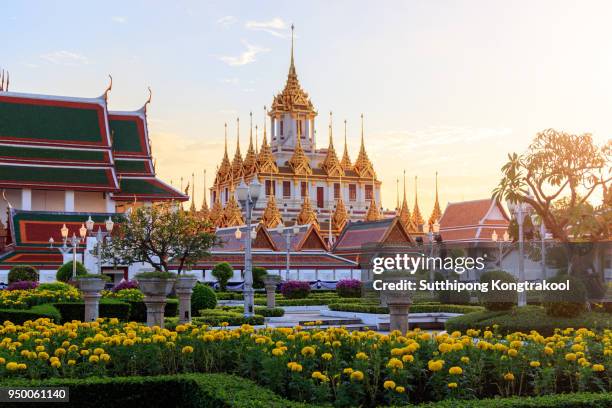 beautiful sky and wat ratchanatdaram temple in bangkok, thailand. thai architecture: wat ratchanadda, loha prasat and traditional thai pavilion is among the best of thailand's landmarks. - bangkok stock-fotos und bilder