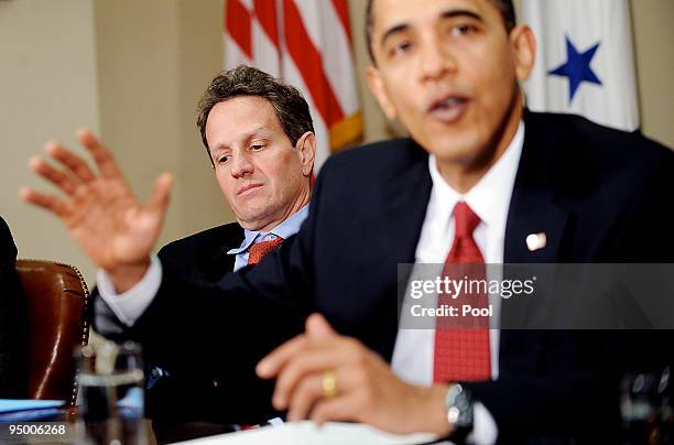 Timothy Geithner, Secretary of the Treasury looks on as President Barack Obama speaks during a meeting with CEOs of several small and community banks...