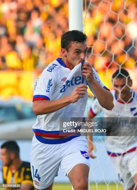 Uruguayan Nacional's player Gonzalo Bueno celebrates after scoring against Penarol during the football derby at the Centenario stadium in Montevideo...