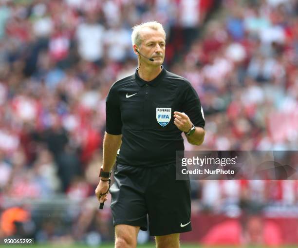 Referee Martin Atkinson during the FA Cup semi-final match between Chelsea and Southampton at Wembley, London, England on 22 April 2018.