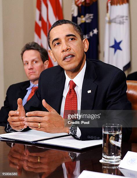 President Barack Obama speaks during a meeting with CEOs of several small and community banks as Timothy Geithner, Secretary of the Treasury listens...