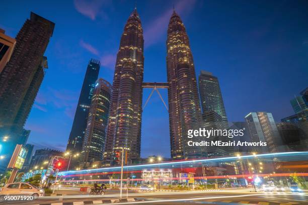 klcc petronas twin tower and four seasons hotel - kuala lumpur twin tower stock pictures, royalty-free photos & images