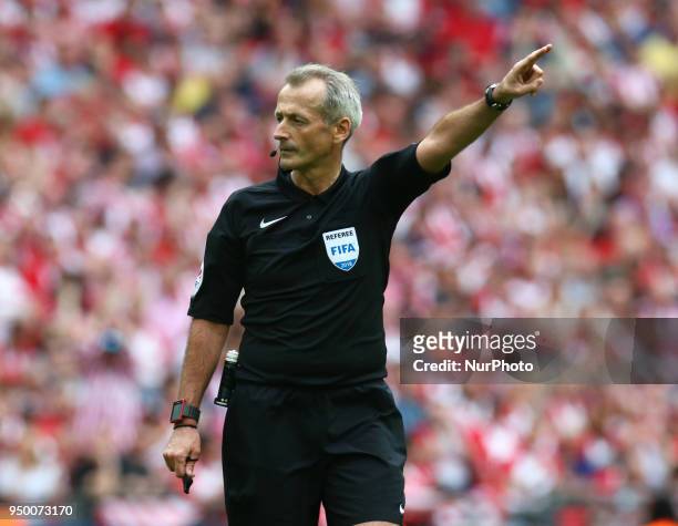 Referee Martin Atkinson during the FA Cup semi-final match between Chelsea and Southampton at Wembley, London, England on 22 April 2018.