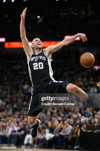 Manu Ginobili of the San Antonio Spurs is stripped of the ball after driving against the Golden State Warriors during the first half of Game Four of...