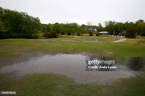 Standing water on the 17th hole of the North Mississippi Classic at the Country Club of Oxford on April 22, 2018 in Oxford, Mississippi. Weather led...