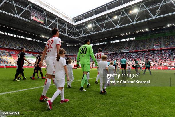 The teams enter the pitch during the Second Bundesliga match between Fortuna Duesseldorf and FC Ingolstadt 04 at Esprit-Arena on April 22, 2018 in...