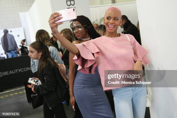 Attendees take a selfie during Beautycon Festival NYC 2018 - Day 1 at Jacob Javits Center on April 21, 2018 in New York City.