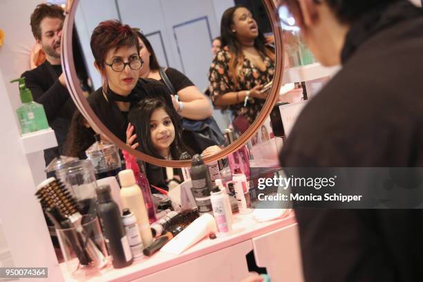 Attendees get their hair styled during Beautycon Festival NYC 2018 - Day 1 at Jacob Javits Center on April 21, 2018 in New York City.