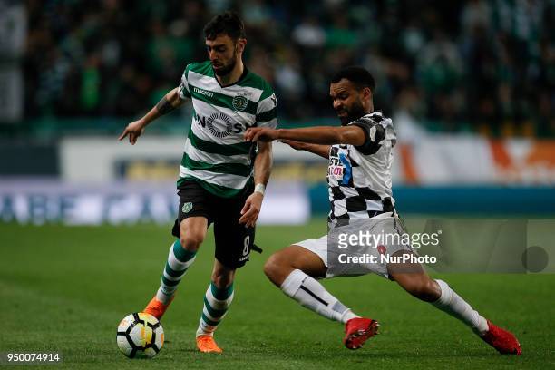 Sporting's midfielder Bruno Fernandes vies for the ball with Boavista's defender Robson during Primeira Liga 2017/18 match between Sporting CP vs...