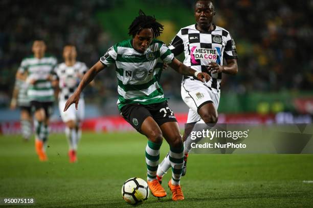 Sporting's forward Gelson Martins vies with Boavista's midfielder Idris during the Portuguese League football match between Sporting CP and Boavista...