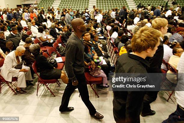 Chad Ochocinco of the Cincinnati Bengals walks in during the funeral for Cincinnati Bengals player Chris Henry at the Alario Center on December 22,...