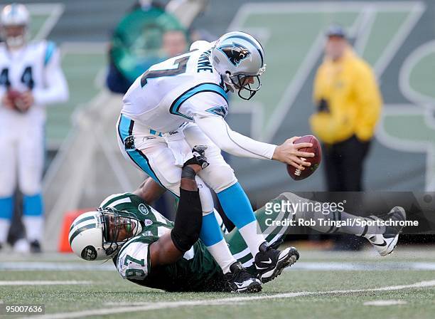 Calvin Pace of the New York Jets sacks Jake Delhomme of the Carolina Panthers at Giants Stadium on November 29, 2009 in East Rutherford, New Jersey....