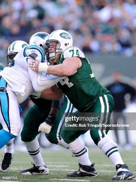 Nick Mangold of the New York Jets blocks against the Carolina Panthers at Giants Stadium on November 29, 2009 in East Rutherford, New Jersey. The...