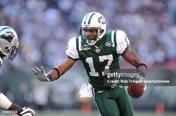 Braylon Edwards of the New York Jets runs with the ball against the Carolina Panthers at Giants Stadium on November 29, 2009 in East Rutherford, New...