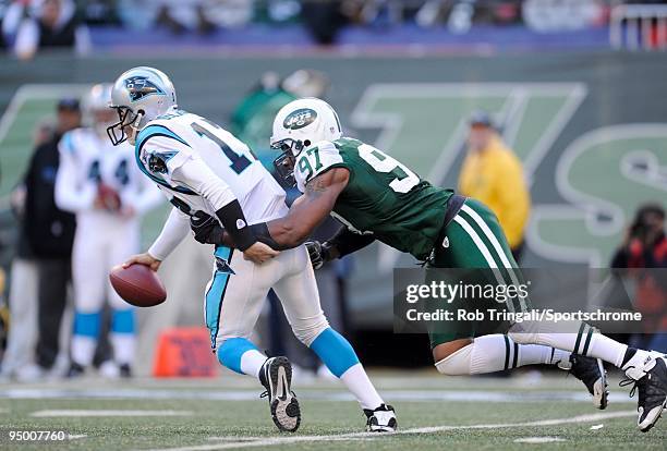 Calvin Pace of the New York Jets sacks Jake Delhomme of the Carolina Panthers at Giants Stadium on November 29, 2009 in East Rutherford, New Jersey....