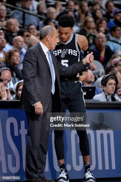 Assistant Coach Ettore Messina and Dejounte Murray of the San Antonio Spurs talk in Game Four of the Western Conference Quarterfinals against the...