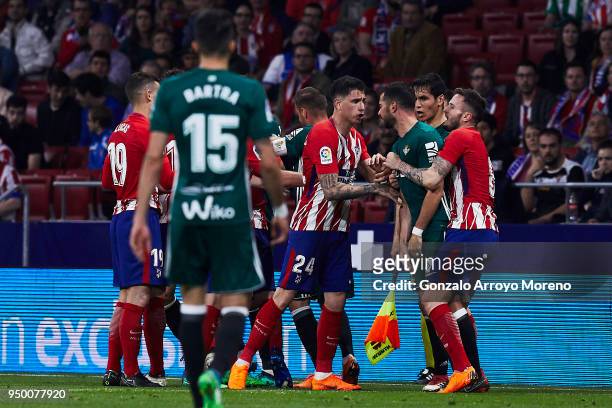 Jose Maria Gimenez of Atletico de Madrid argues with Jordi Amat of Real Betis Balompie during the La Liga match between Club Atletico Madrid and Real...