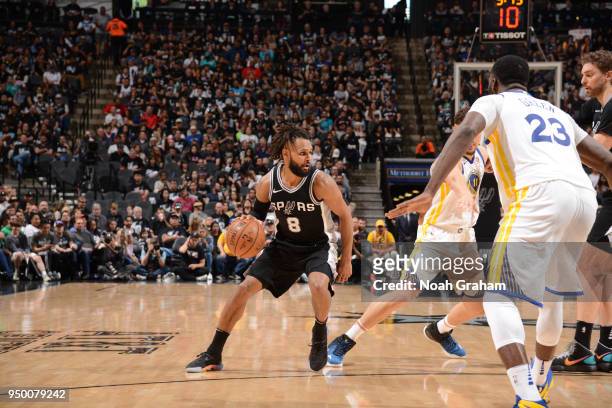 Patty Mills of the San Antonio Spurs handles the ball against the Golden State Warriors in Game Four of Round One of the 2018 NBA Playoffs on April...