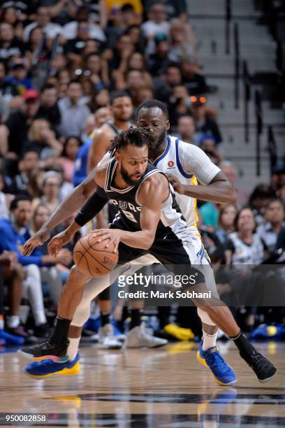 Patty Mills of the San Antonio Spurs handles the ball against the Golden State Warriors in Game Four of the Western Conference Quarterfinals during...