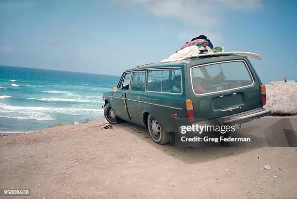 car on a beach - station wagon stock pictures, royalty-free photos & images