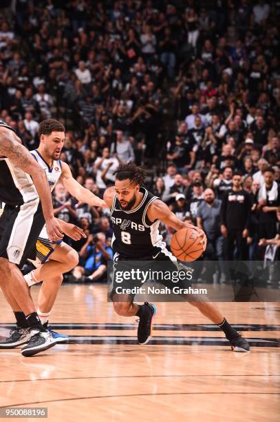 Patty Mills of the San Antonio Spurs handles the ball against the Golden State Warriors in Game Four of Round One of the 2018 NBA Playoffs on April...