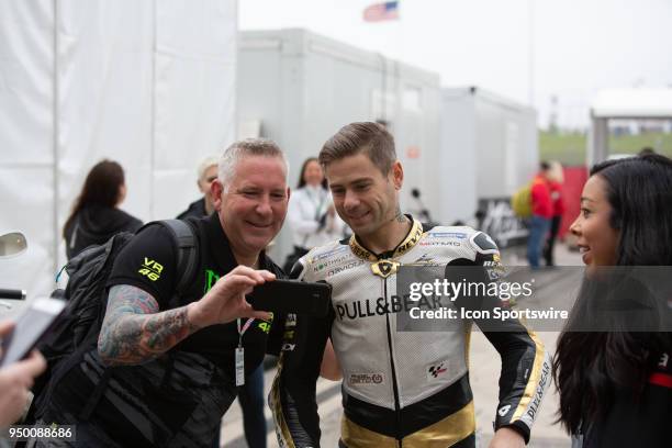Angel Nieto Team Alvaro Bautista takes a selfie photo with a fans during the MotoGP Red Bull U.S. Grand Prix of The Americas - Qualifying at Circuit...
