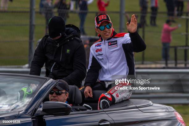 Honda IDEMITSU Takaaki Nakagami waving to fans LCR Honda CASTROL Cal Crutchlow covers his head during the MotoGP Red Bull Riders Parade U.S. Grand...