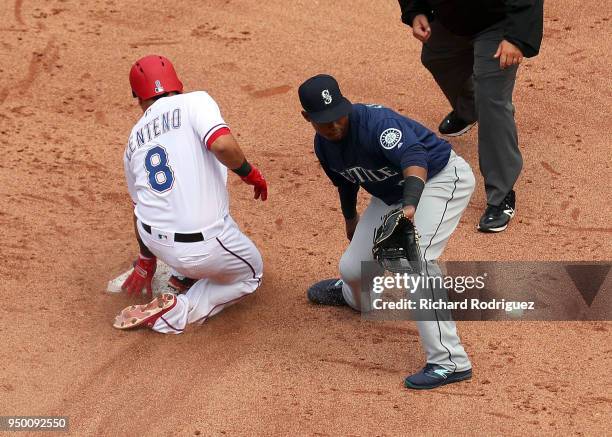 Juan Centeno of the Texas Rangers beats the throw to Jean Segura of the Seattle Mariners for a double in the fifth inning agaisnt at Globe Life Park...