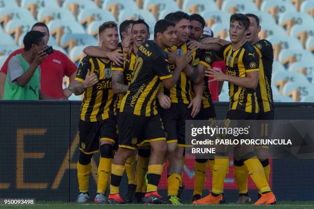 Penarol's footballers celebrate Christian's Rodriguez goal during Uruguay's football derby against Nacional at the Centenario Stadium in Montevideo...